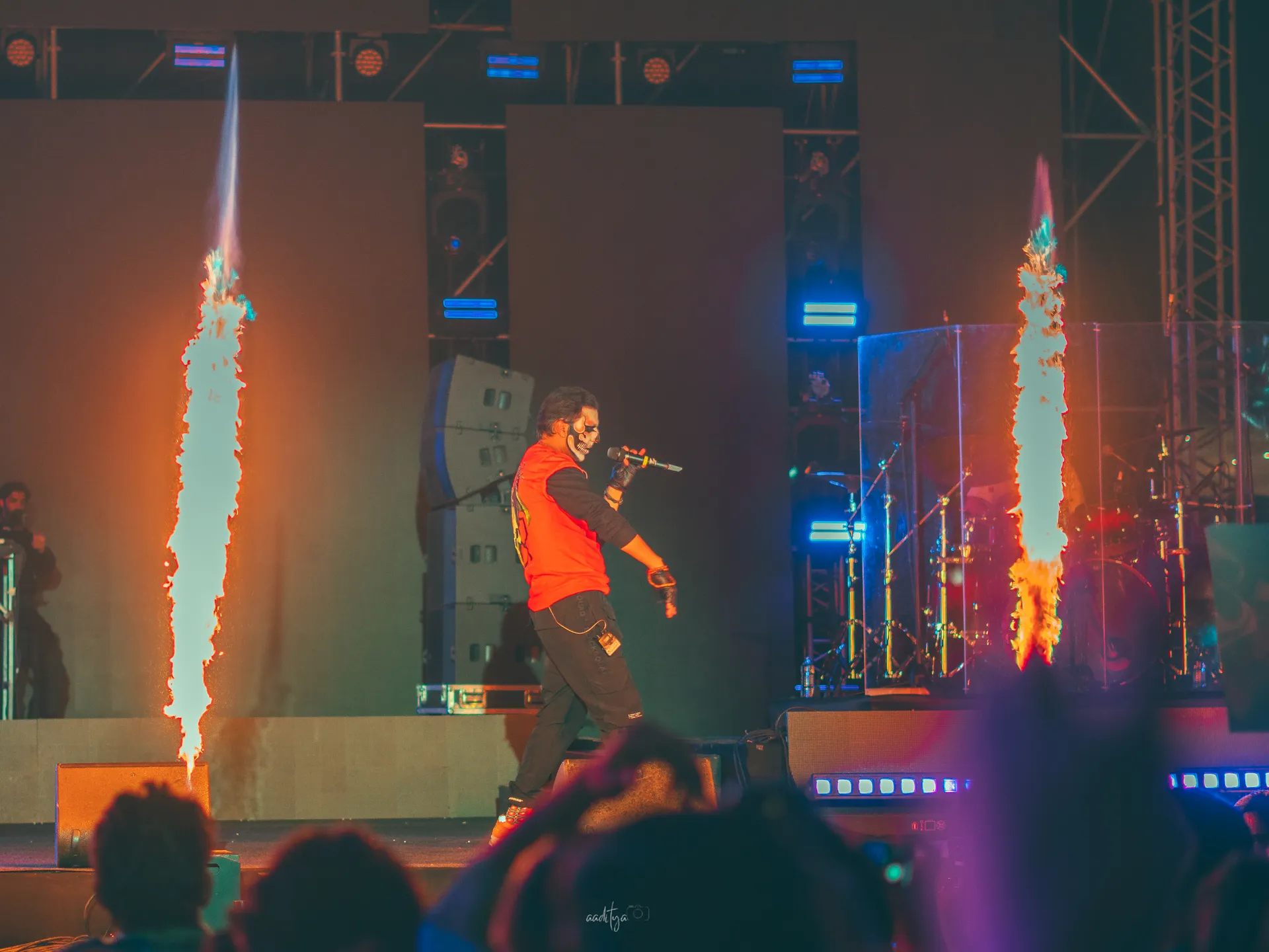Talwiinder performing under twin pyro flame towers at District by Zomato